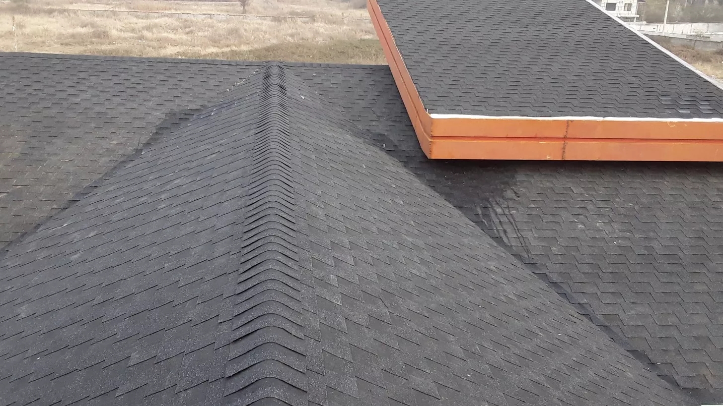 Collection of the old roof and installation of bee shingles