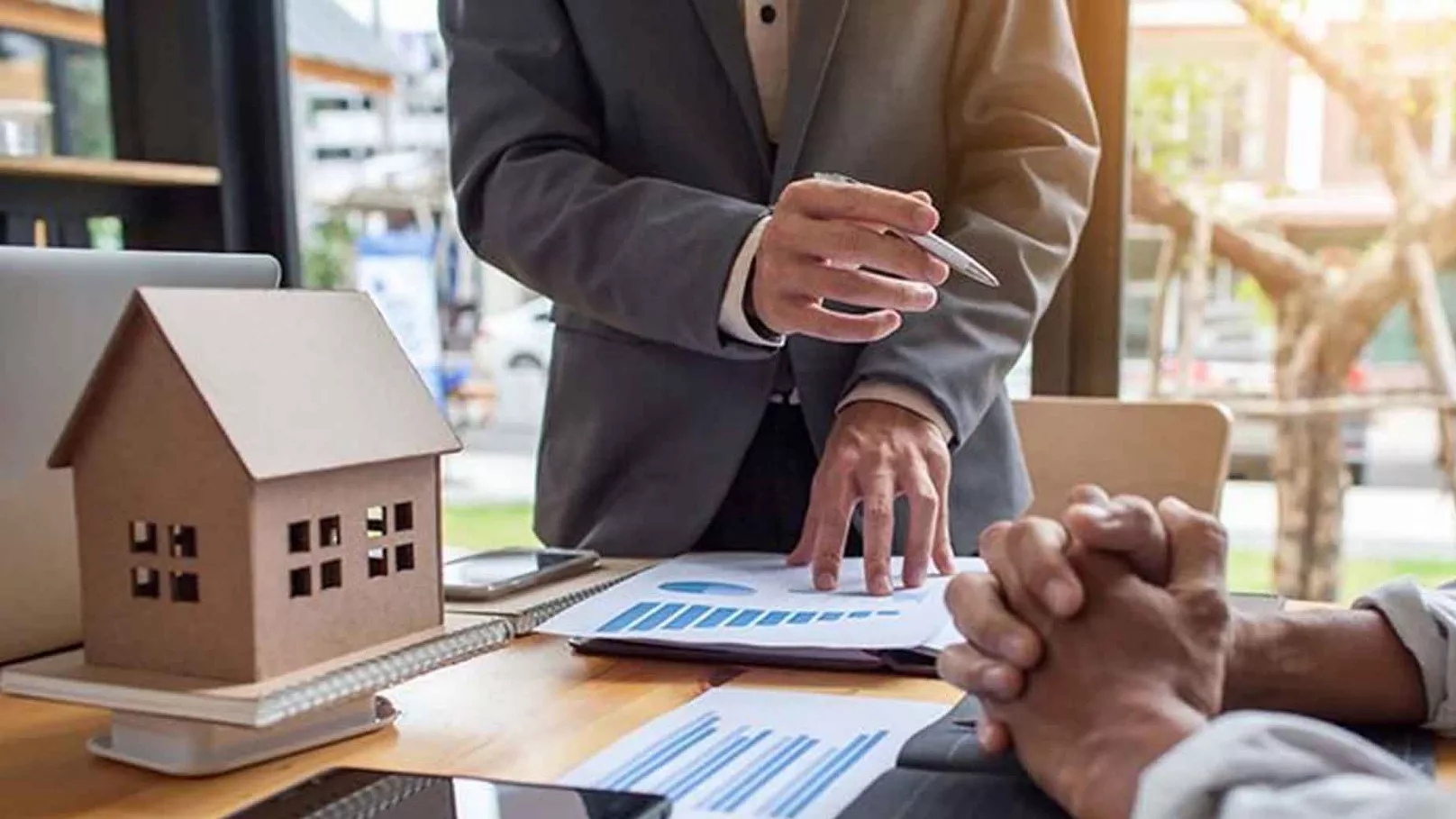 Why is it necessary to have a real estate agent in buying a property?