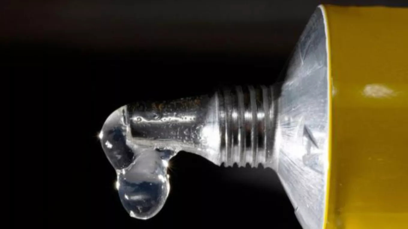 What kind of materials do adhesives stick in the packaging industry?