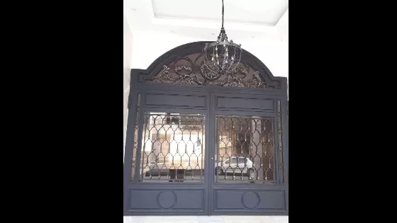 Wrought iron door with handmade flowers