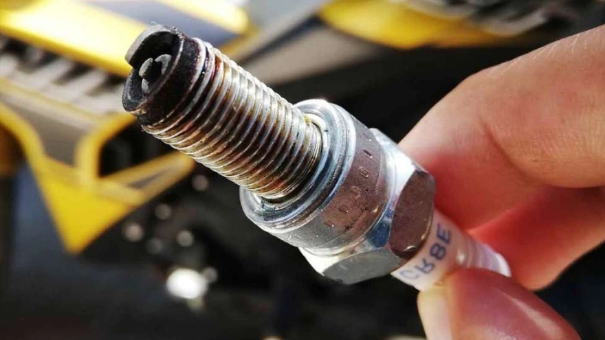 What is the use of a candle in a motorcycle?
