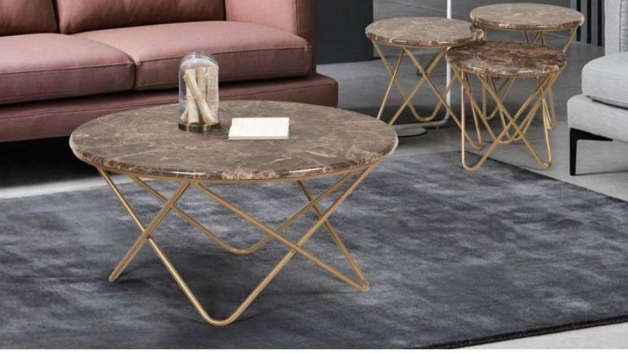 Honey metal table and in front of the sofa