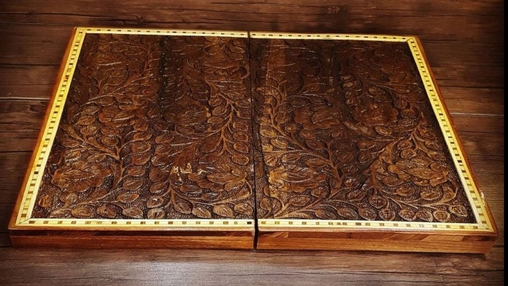 What kind of wood is the inlaid backgammon made of?