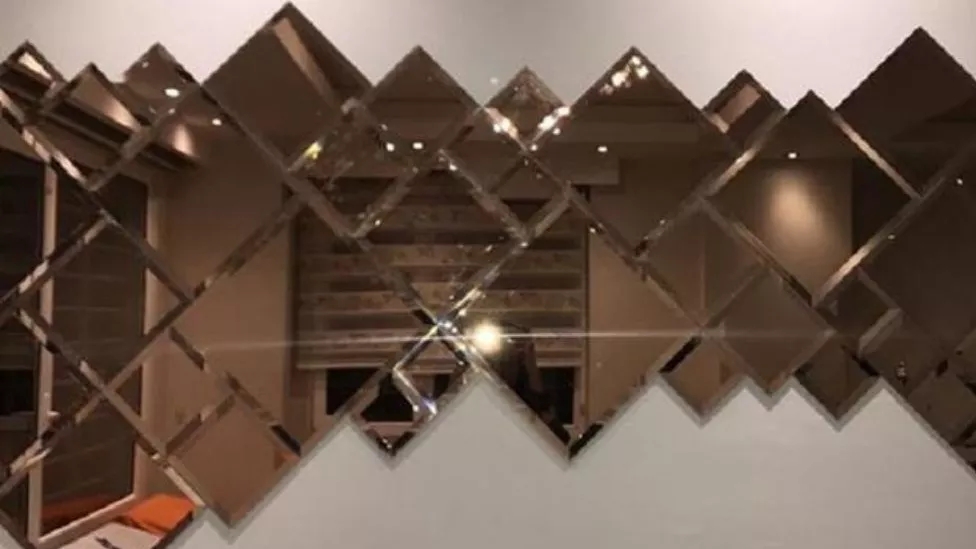 What is mirror work and what effect does it have on interior decoration?