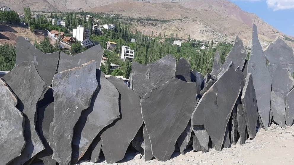 The use of rubble stone in the area and facade of the building