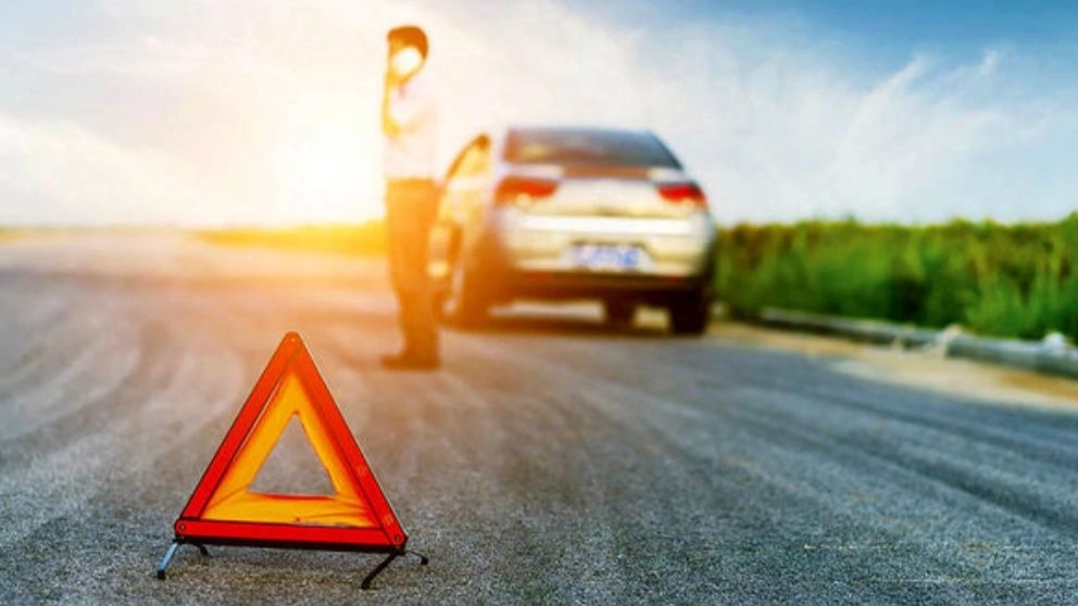 Why is it necessary to have a car assistance number?