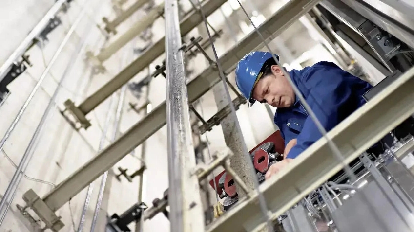 What does elevator service and maintenance include?
