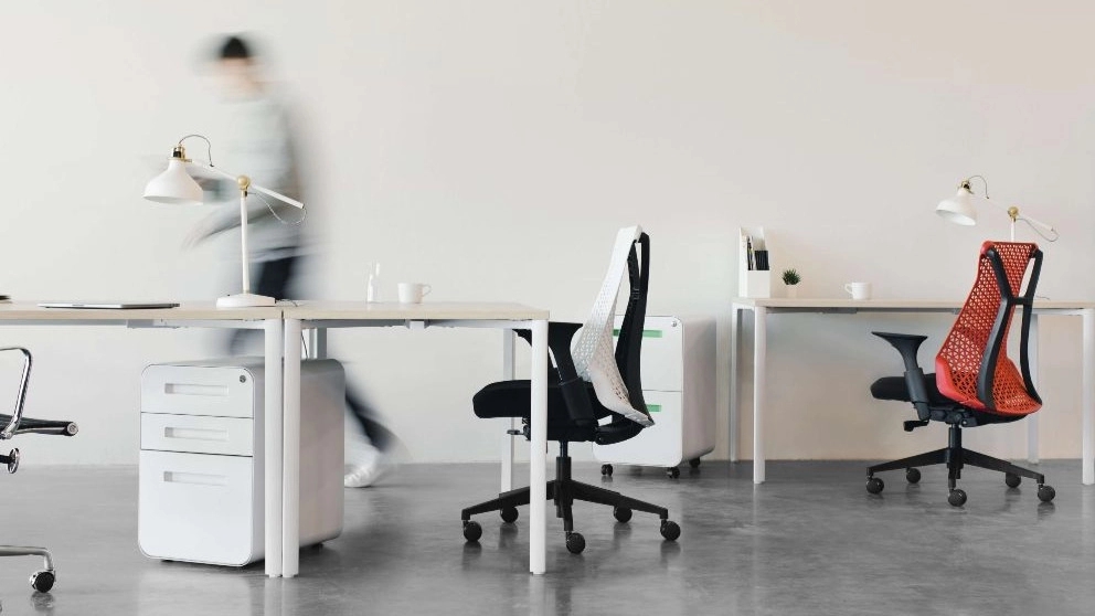 Why is it important to use an ergonomic office chair in the workplace?