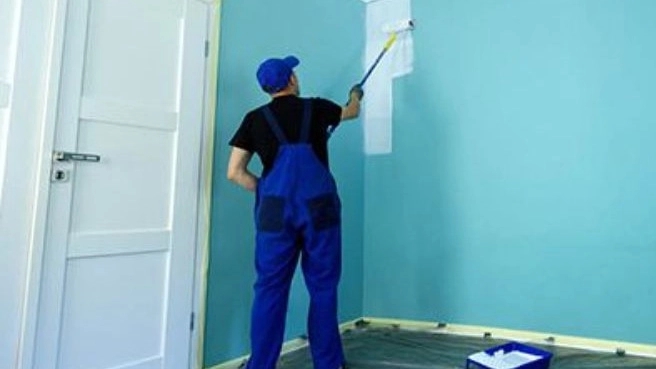 Painting the building with plastic paint