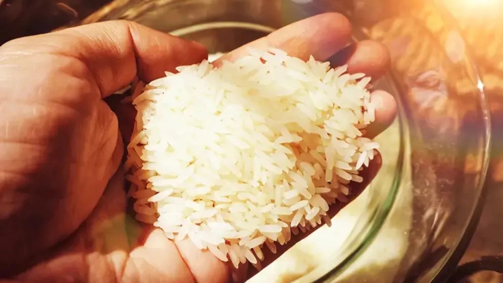 Why should rice be soaked before cooking?