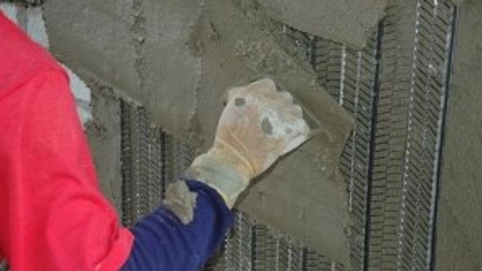 How is the cementing of the facade of the building done?