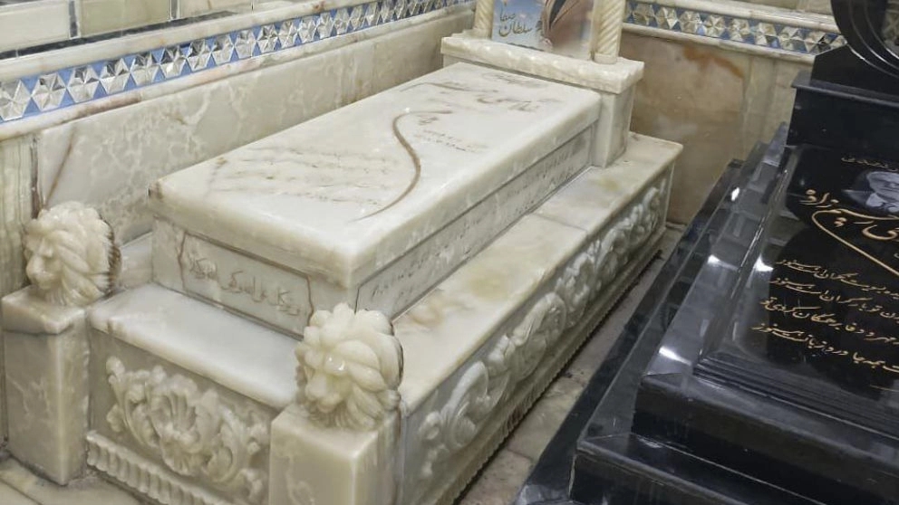 A simple black tombstone in Tehran Stone Town