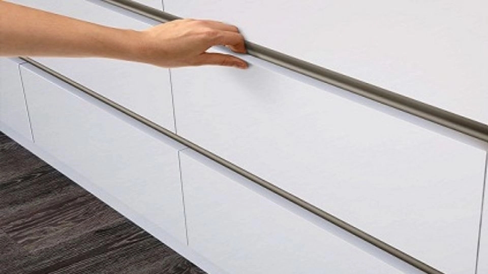 What is the hidden handle of the cabinet?