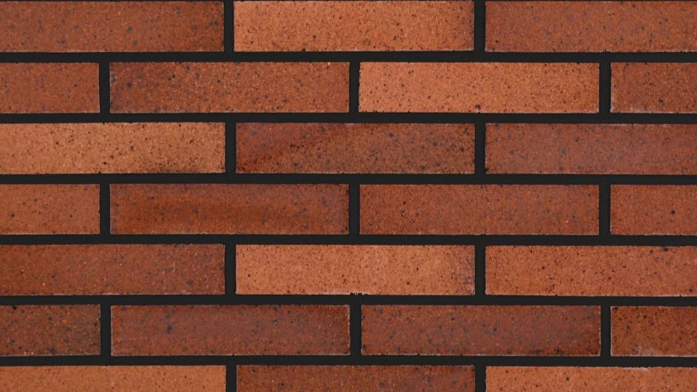 What is the difference between normal brick and refractory brick?