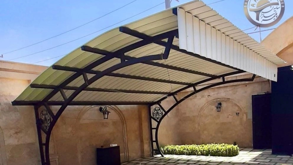Polymer shade makers, car and gazebo shading and the modern facade of the building in Karaj