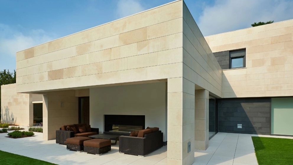 Facade of modern building with travertine stone