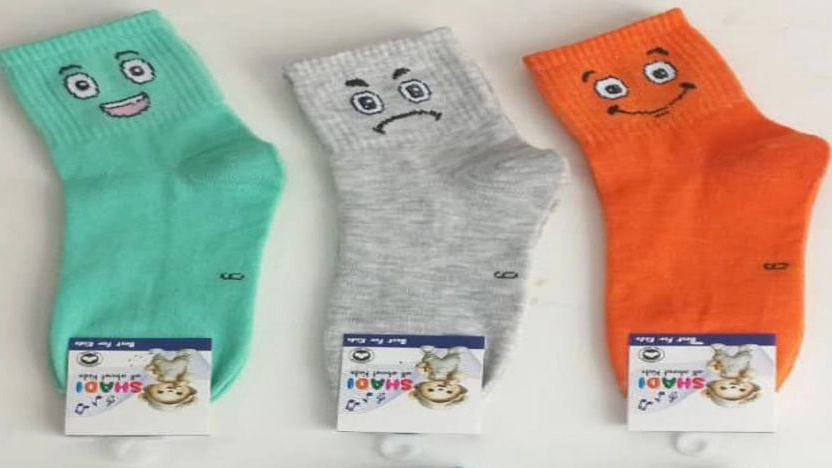 Export of children's socks with face designs