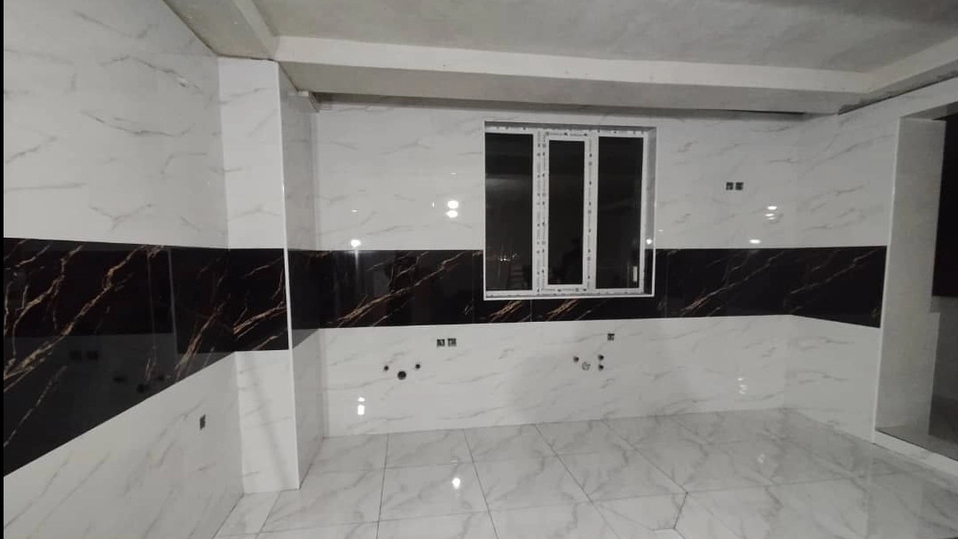 Abdullahi building facade, tile and stone work in Bukan