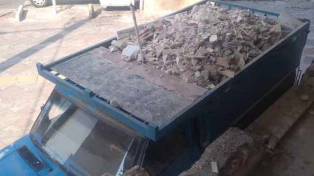 Mohammed waste, distributing materials and cargo with Nissan Dump in Tehran