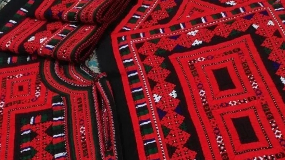Zai Astin Naroi, designing and sewing traditional women's clothes in Zahedan