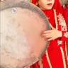 Banu Quchani's band of musicians, a player of the daf instrument for gatherings in Quchani