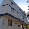 Working at the height of Qoms, washing the facade and installing signs in Semnan