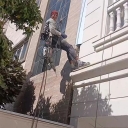 Working at zero altitude, washing the facade and cleaning the glass in Shiraz