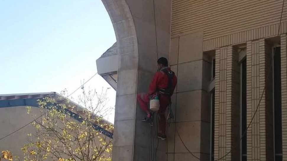 Working at zero altitude, washing the facade and cleaning the glass in Shiraz