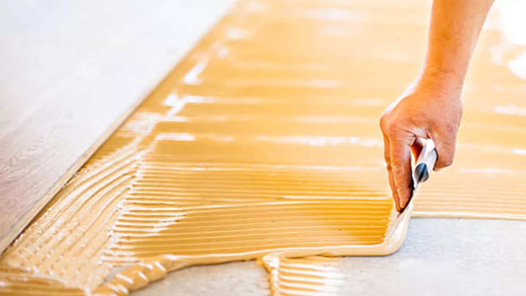 What is tile adhesive and what are its features and applications?