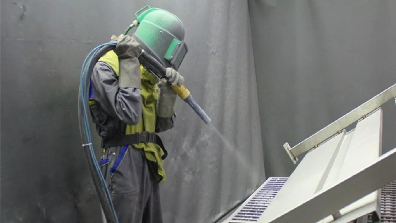What is the difference between sandblast and shot blast?