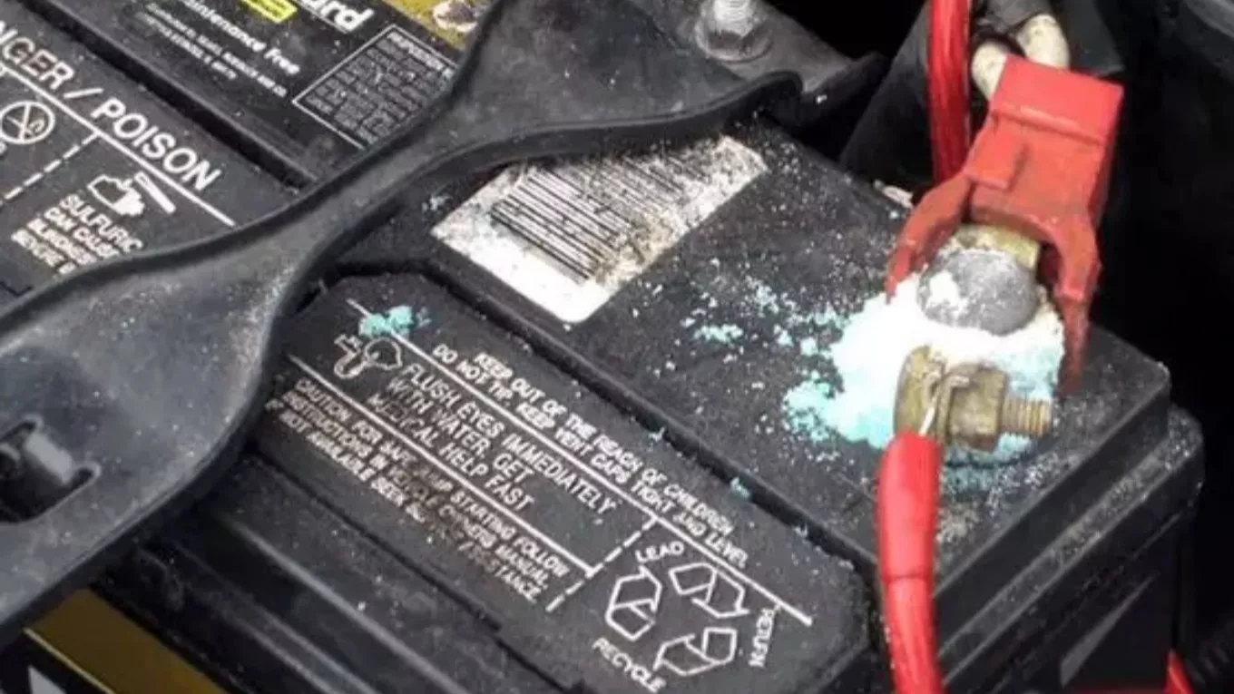What is the cause of the car battery turning white?