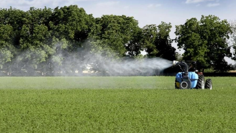 What is the sprayer behind the tractor?