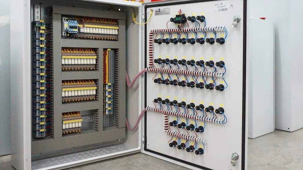 What is the role of the elevator control panel in the elevator system?