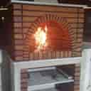 Modern fireplace, construction and installation of brick fireplace and barbecue, building decorations in Lahijan