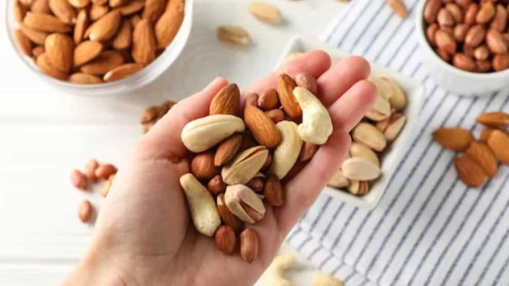 Why should nuts and dried fruits be stored in the refrigerator?