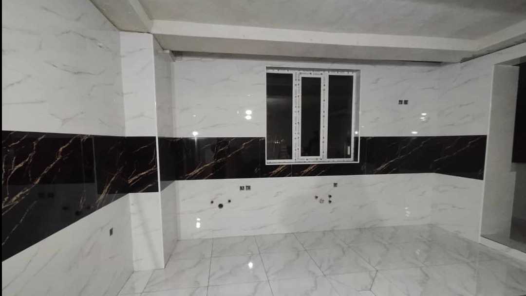Abdullahi building facade, tile and stone work in Bukan