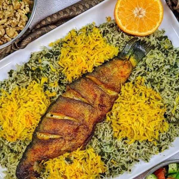 Vegetable pilaf with whole fish (salmon)