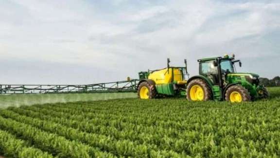 Sprayer behind the tractor