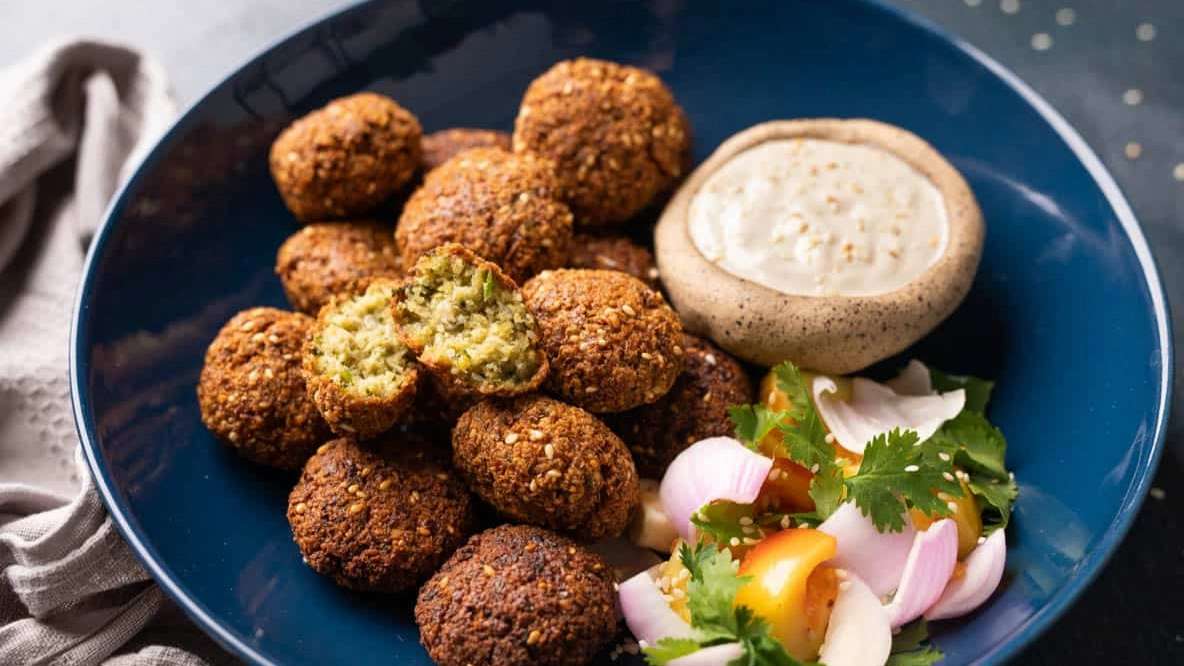 Preparing food outside for Nazbanu