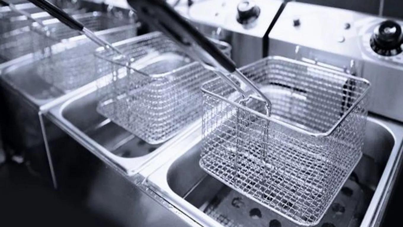 What is an industrial fryer and where is it used?
