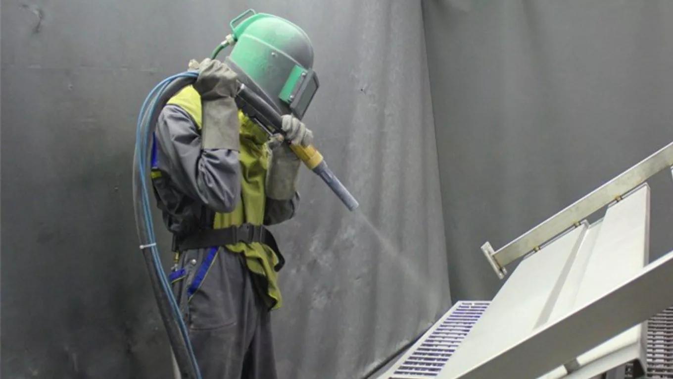 What is the difference between sandblast and shot blast?